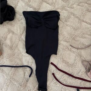 Skims black strapless bodysuit